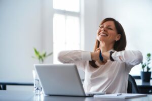 Woman happy about SEO tactics working for her hearing practice website