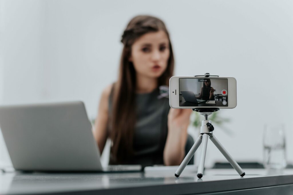 Woman records video on her phone