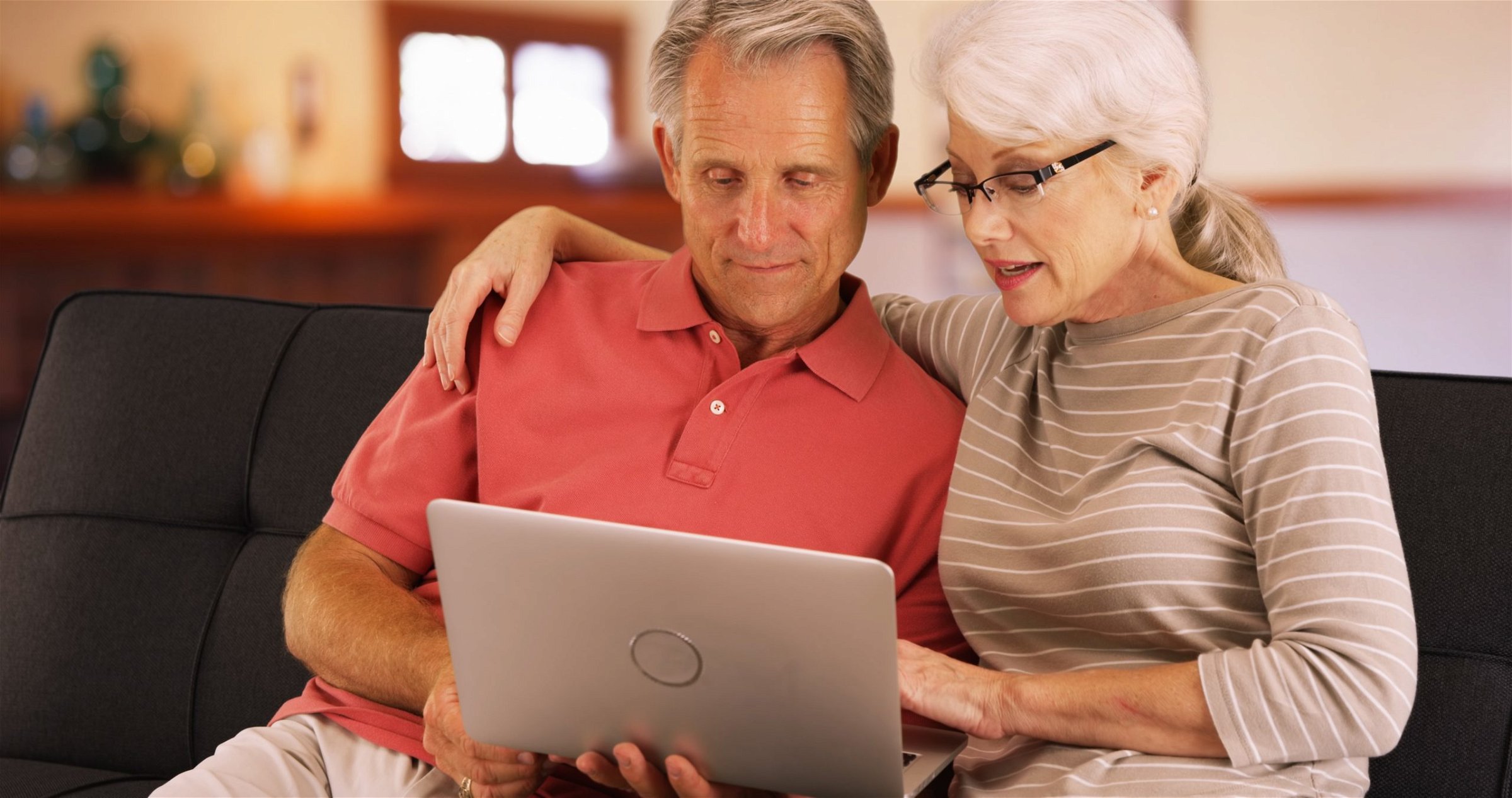 Man and Woman look at computer together