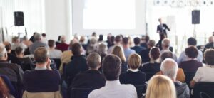 professional gives speech to group