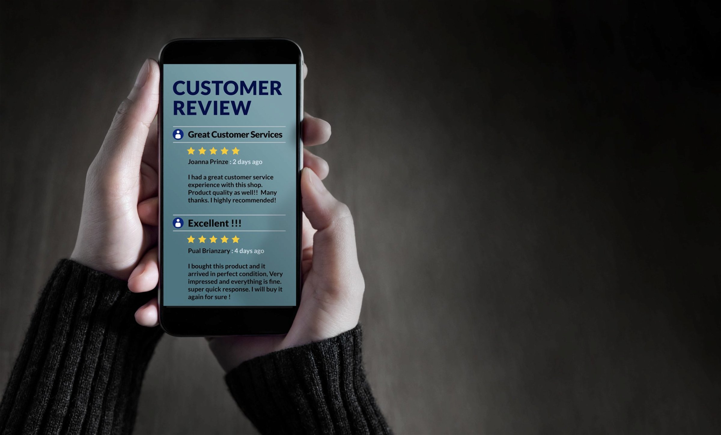 A person holds a phone with customer reviews on it