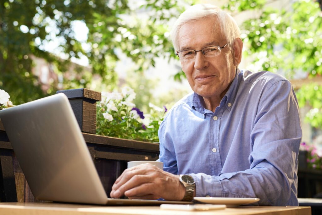 Man on computer smiling